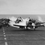 Planes landing on a WWII US Navy aircraft carrier