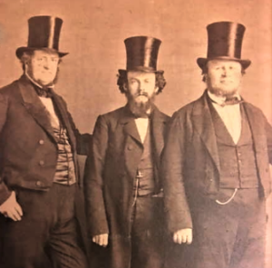 The men at left and center are unknown but one may be Alexander Baird.
